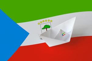 Equatorial Guinea flag depicted on paper origami ship closeup. Handmade arts concept photo