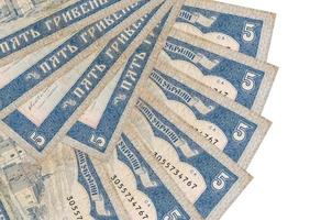 5 Ukrainian hryvnias bills lies isolated on white background with copy space stacked in fan shape close up photo