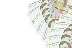 100 Ukrainian hryvnias bills lies isolated on white background with copy space. Rich life conceptual background photo