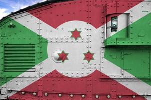 Burundi flag depicted on side part of military armored tank closeup. Army forces conceptual background photo