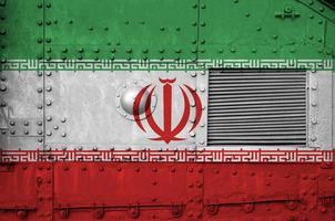 Iran flag depicted on side part of military armored tank closeup. Army forces conceptual background photo