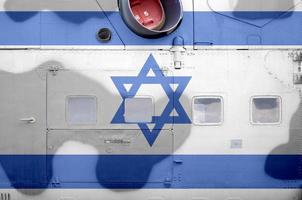 Israel flag depicted on side part of military armored helicopter closeup. Army forces aircraft conceptual background photo