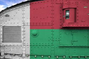 Madagascar flag depicted on side part of military armored tank closeup. Army forces conceptual background photo