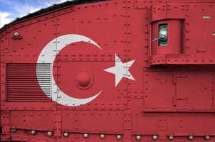 Turkey flag depicted on side part of military armored tank closeup. Army forces conceptual background photo