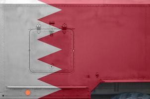 Bahrain flag depicted on side part of military armored truck closeup. Army forces conceptual background photo