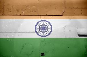 India flag depicted on side part of military armored helicopter closeup. Army forces aircraft conceptual background photo