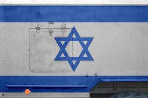 Israel flag depicted on side part of military armored truck closeup. Army forces conceptual background photo