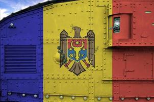 Moldova flag depicted on side part of military armored tank closeup. Army forces conceptual background photo