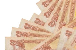 1 Ukrainian coupon bills lies in different order isolated on white. Local banking or money making concept photo