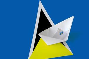 Saint Lucia flag depicted on paper origami ship closeup. Handmade arts concept photo