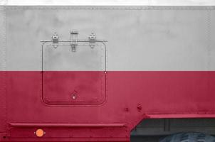 Poland flag depicted on side part of military armored truck closeup. Army forces conceptual background photo