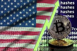 United States of America flag and rising green arrow on bitcoin mining screen and two physical golden bitcoins photo