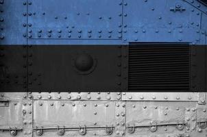 Estonia flag depicted on side part of military armored tank closeup. Army forces conceptual background photo