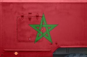 Morocco flag depicted on side part of military armored truck closeup. Army forces conceptual background photo