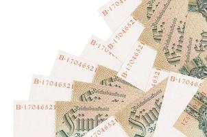 50 Reich marks bills lies in different order isolated on white. Local banking or money making concept photo