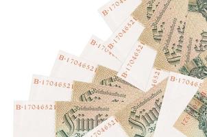 50 Reich marks bills lies in different order isolated on white. Local banking or money making concept photo