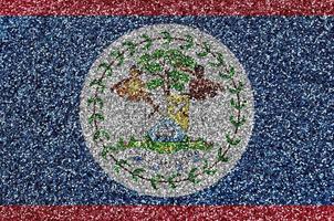 Belize flag depicted on many small shiny sequins. Colorful festival background for party photo