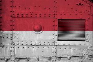 Monaco flag depicted on side part of military armored tank closeup. Army forces conceptual background photo