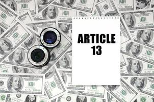 Two photographic lenses and notebook with article 13 inscription photo