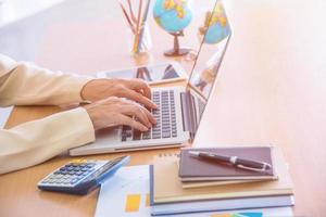 Business woman using laptop. photo