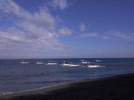 Rows of fishing boats on the beach photo