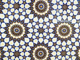 traditional Uzbek pattern on ceramic tile on wall of mosque Seamless old floral pattern Abstract background photo