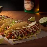 High angle mexican tacos on wooden background photo