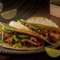 High angle mexican tacos on wooden background