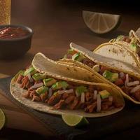 High angle mexican tacos on wooden background photo