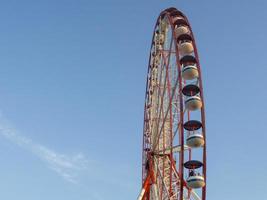 Ferris wheel against the sky. Amusement park on the sea. Rest zone. Ferris wheel. photo