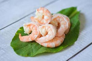 Fresh shrimp on fresh vegetables, cooked shrimps prawns seafood, cooking boiled shrimp photo