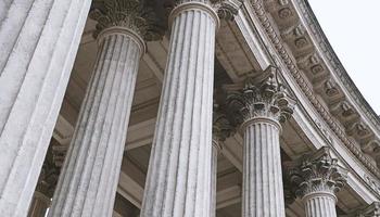 Classic architectural column. Details of the architecture of a historical building. Element of exterior building with columns and Stucco molding on the ceiling of Cathedral in St. Petersburg, Russia. photo