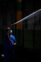 Bangkok, Thailand - September 24  A cleaner is cleaning a train at Hua Lamphong Station on September 24, 2022 in Bangkok, Thailand. photo