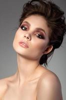 Portrait of beautiful woman with evening makeup photo