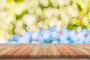 Empty wood table top with blur Christmas tree with bokeh light background photo