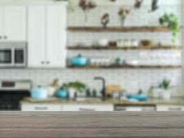 The empty table wooden board in front of the background is blurred. Brown wood perspective in the home kitchen can be used to display or montage your products. Mock up for product display. photo