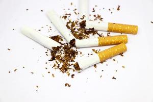 Stop smoking concept Half and Half broken cigarette isolated on white background photo