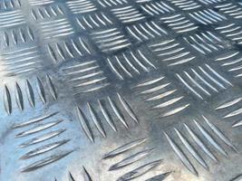 Metal sheet with volume ornament for use as an anti-slip coating. Metal sheet background and texture photo