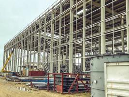 metal structure at the construction site. mine construction. warehouse for building materials. tall metal building for storage of building materials photo