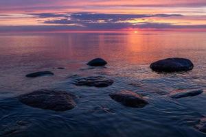 Stones on The Coast of The Baltic Sea at Sunset photo