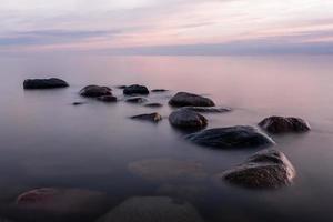 Stones on The Coast of The Baltic Sea at Sunset photo