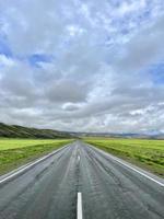 The road goes into the distance in the mountains, a part of the Chuisky tract , Altai, Russia photo