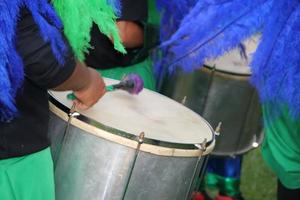 percussion instruments feathers and carnival embroidery photo