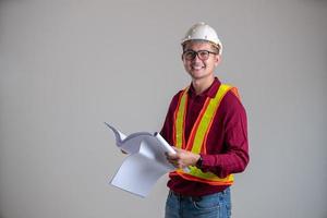 smiling face of engineering holding blueprint