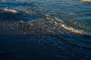 Seascape wave of the sea on the sandy beach photo