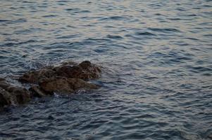 Croatia beach, rocks at the beach, sea water, waves photo