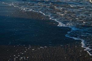 Seascape wave of the sea on the sandy beach photo