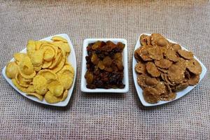 Corn flakes, raisins in a plate. breakfast. Healthy food, diet. photo