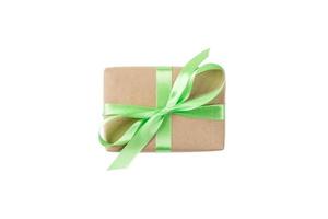 Gift box with green ribbon isolated on white background. holiday concept you you design. top view photo