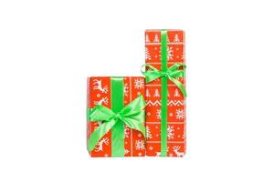 Set of Christmas or other holiday handmade present in red paper with green ribbon. Isolated on white background, top view. thanksgiving Gift box concept photo